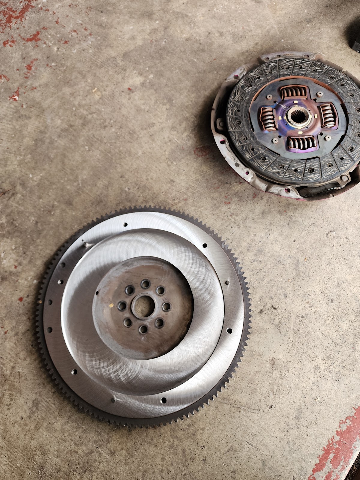An old clutch plate and flywheel removed from a car